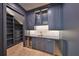 Elegant bar area featuring custom cabinetry, a wine cooler, and a modern sink at 4224 W Corona St, Tampa, FL 33629