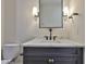 Bathroom features a vanity with a sleek black design and a marble countertop at 4224 W Corona St, Tampa, FL 33629