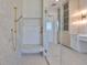 Modern bathroom featuring a glass shower with gold fixtures and marbled tile at 4224 W Corona St, Tampa, FL 33629