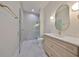 Elegant bathroom featuring marble floors, frameless glass shower, and a stylish vanity with gold accents at 4224 W Corona St, Tampa, FL 33629