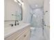 Contemporary bathroom showcasing a walk-in shower with glass enclosure, a modern vanity, and elegant fixtures at 4224 W Corona St, Tampa, FL 33629