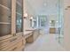 Spacious bathroom featuring double vanities, soaking tub, walk-in closet and glass shower at 4224 W Corona St, Tampa, FL 33629