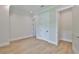 Bedroom with a closet and an ensuite bathroom that features hardwood flooring at 4224 W Corona St, Tampa, FL 33629