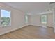 Spacious bedroom with light-filled windows, neutral walls, and warm wood floors at 4224 W Corona St, Tampa, FL 33629