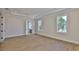 Bedroom featuring tray ceilings, hardwood floors, white trim and windows at 4224 W Corona St, Tampa, FL 33629
