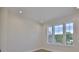 Bright room features recessed lighting, trim, and a multi-pane window overlooking the exterior of the property at 4224 W Corona St, Tampa, FL 33629