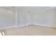Inviting bedroom with warm wood floors, neutral walls, and white doors leading to other rooms at 4224 W Corona St, Tampa, FL 33629