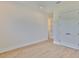 Large bedroom features wood-look floors, white trim, an interior door, and a double closet at 4224 W Corona St, Tampa, FL 33629