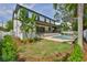 Exterior view of white two-story house, backyard, and pool at 4224 W Corona St, Tampa, FL 33629