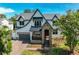 Charming exterior of a well-manicured home with stone accents and lush landscaping at 4224 W Corona St, Tampa, FL 33629