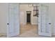 A grand foyer entry way with french doors, hardwood flooring, and an elevator at 4224 W Corona St, Tampa, FL 33629