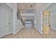 Inviting foyer with hardwood floors, staircase, and decorative wooden doors at 4224 W Corona St, Tampa, FL 33629