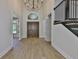Grand foyer with soaring ceilings, wooden floors, staircase and double front doors at 4224 W Corona St, Tampa, FL 33629