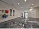 Spacious garage featuring a sleek epoxy floor, ample lighting, and room for multiple vehicles at 4224 W Corona St, Tampa, FL 33629