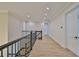 Second floor hallway with hardwood floors and modern doors at 4224 W Corona St, Tampa, FL 33629