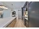 A gourmet kitchen features stone backsplash, chef's range, custom cabinetry and large center island with pendant lights at 4224 W Corona St, Tampa, FL 33629