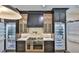 Gourmet kitchen features a stainless range, dual refrigerators and custom cabinets at 4224 W Corona St, Tampa, FL 33629