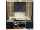 Kitchen featuring stainless steel range and custom range hood at 4224 W Corona St, Tampa, FL 33629