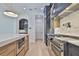 Gourmet kitchen features a professional-grade range, custom cabinetry, stone backsplash, and a large center island at 4224 W Corona St, Tampa, FL 33629
