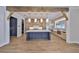 Spacious kitchen with an island, modern appliances, custom cabinetry, and wood beam accents at 4224 W Corona St, Tampa, FL 33629