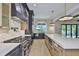 Luxury kitchen with a large island, stone backsplash, and chef-grade appliances at 4224 W Corona St, Tampa, FL 33629