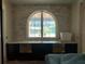 Kitchen area with an arched window and custom cabinetry at 4224 W Corona St, Tampa, FL 33629
