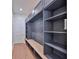 Mudroom with built-in shelving, bench, and decorative wall paneling for organized entryway and storage at 4224 W Corona St, Tampa, FL 33629