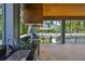 Covered outdoor kitchen with stainless appliances and sink next to pool and patio at 4224 W Corona St, Tampa, FL 33629