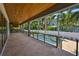 Back patio overlooking pool, backyard, and palm trees in the Florida sunshine at 4224 W Corona St, Tampa, FL 33629