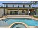 Backyard pool with travertine decking and attached spa at 4224 W Corona St, Tampa, FL 33629