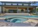 Inviting backyard pool and spa with travertine decking and covered porch at 4224 W Corona St, Tampa, FL 33629