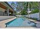 Sparkling swimming pool and spa with patio area and manicured landscaping at 4224 W Corona St, Tampa, FL 33629