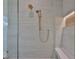 Walk-in shower featuring rainfall showerhead and built-in bench at 4224 W Corona St, Tampa, FL 33629