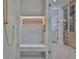 Walk-in shower featuring rainfall showerhead and built-in bench at 4224 W Corona St, Tampa, FL 33629
