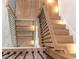 Modern staircase showcasing wooden steps, sleek black railings, and ambient lighting for a stylish design at 4224 W Corona St, Tampa, FL 33629