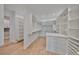 Well-organized walk-in closet with ample shelving, hanging space, and a central island with drawers at 4224 W Corona St, Tampa, FL 33629