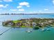 Aerial view of luxury waterfront homes showcasing private docks and panoramic water views at 429 St Andrews Dr, Belleair, FL 33756
