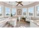 Bright bathroom with large windows, soaking tub, and neutral finishes and waterfront view at 429 St Andrews Dr, Belleair, FL 33756