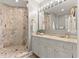 Elegant bathroom features a spacious marble shower and vanity with bright lighting at 429 St Andrews Dr, Belleair, FL 33756