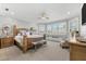 Comfortable bedroom with large windows, shutters and cozy window seating at 429 St Andrews Dr, Belleair, FL 33756