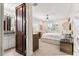 Bright bedroom view featuring large windows and an ensuite bathroom at 429 St Andrews Dr, Belleair, FL 33756