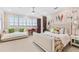Unique bedroom with whimsical artwork and bay window offers a relaxing retreat at 429 St Andrews Dr, Belleair, FL 33756