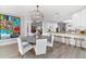 Open floor plan dining area adjacent to kitchen with bar stool seating at 429 St Andrews Dr, Belleair, FL 33756