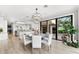 Open floor plan kitchen and dining area with water view at 429 St Andrews Dr, Belleair, FL 33756