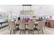 Beautiful dining room with a chandelier and an adjacent seating area at 429 St Andrews Dr, Belleair, FL 33756