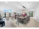 Beautifully appointed dining room adjacent to the living room, bar, and other living areas at 429 St Andrews Dr, Belleair, FL 33756