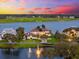 Waterfront home next to a golf course with beautiful landscaping at 429 St Andrews Dr, Belleair, FL 33756