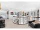The second story hallway has art and sculptures, with views of the water at 429 St Andrews Dr, Belleair, FL 33756