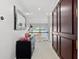 Hallway with view of waterfront and chandelier, featuring a dark wood accent door at 429 St Andrews Dr, Belleair, FL 33756