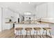Bright kitchen with granite countertops, stainless appliances, and breakfast bar at 429 St Andrews Dr, Belleair, FL 33756